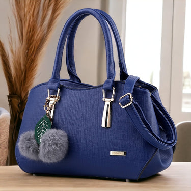 Fashion hand bag with a hair ball