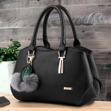 Fashion hand bag with a hair ball